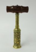 A 19th Century Thomason type double action cork screw with turned wood handle, embossed barrel