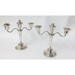 A pair of Geo V twin branch silver candelabras, height 22cm.