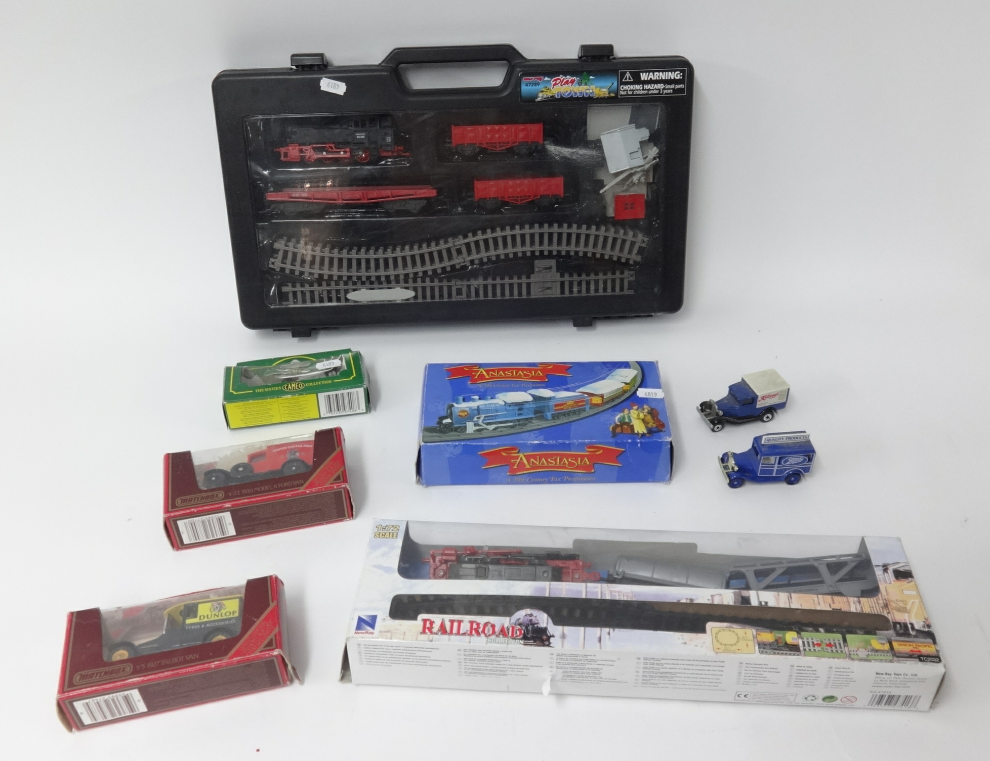 Three battery train sets including rail road and also some Models of Yesteryear.