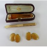 A collection of gentleman's cufflinks, tie clip and gold mounted cheeroot holder, cased (3).