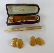 A collection of gentleman's cufflinks, tie clip and gold mounted cheeroot holder, cased (3).