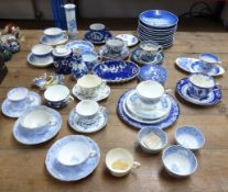 A collection of 19th century and later blue and white teacups and saucers including Royal Worcester,