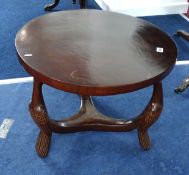 A heavy carved wood ‘tribal’ table and an Edwardian inlaid circular occasional table (2).