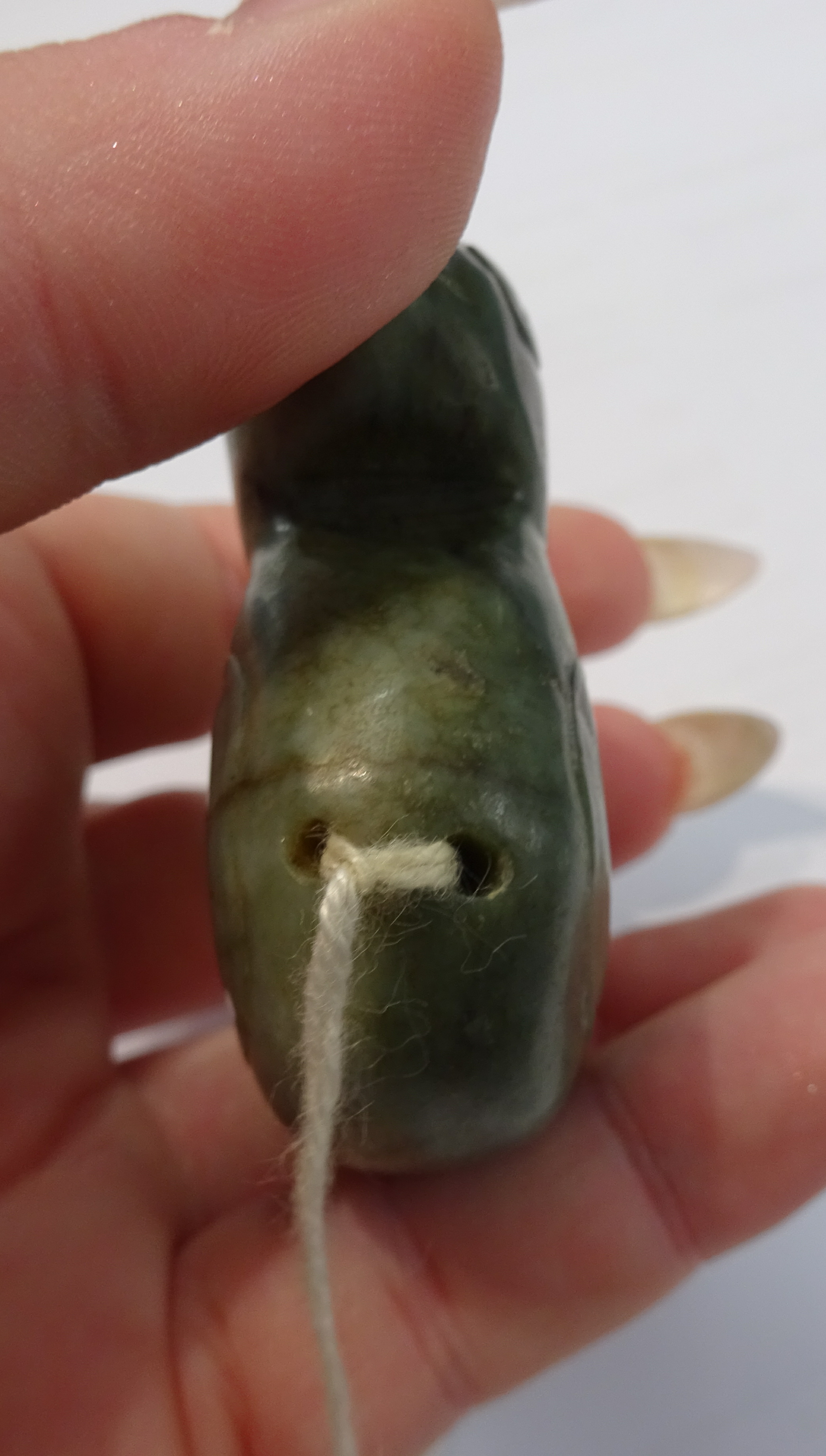 An oriental carved jade figure, a carved pig and dark green jade duck pendant, the tallest 7cm (3). - Image 3 of 10