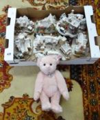 A collection of Lilliput Lane cottages and a modern Steiff pink teddy bear.
