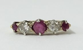 An 18ct ruby and diamond five stone ring.