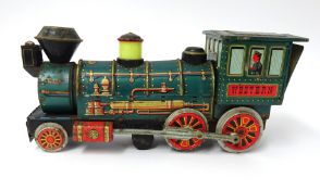 Japanese tinplate Western locomotive and key, length 33cm.