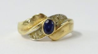 An 14ct sapphire and diamond ring (4.2gms).