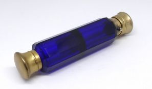 Sampson & Morden, London, a Victorian blue glass double end scent bottle with silver gilt tops,