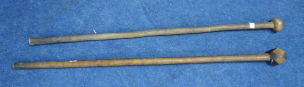 Two African knobkerrie carved sticks and two carved elephants (4)