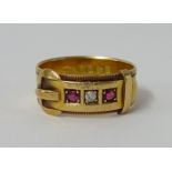An 18ct buckle ring set with two ruby's and a diamond, 5.5gms.