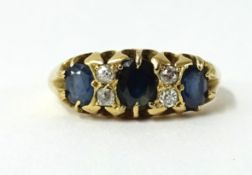 An 18ct sapphire and diamond seven stone ring.