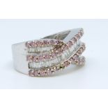 A 9ct white gold diamond half band eternity ring, size N.