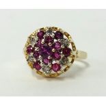 A 9ct gold ruby and diamond cluster ring, size L.