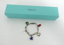 A Tiffany four stone charm bracelet by Elsa Peretti, sterling silver with a red jasper Bean,