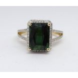 A 14ct yellow gold and diamond ring set with an emerald cut green tourmaline, approx. 3.97carat,