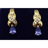 A pair of 14ct diamond and tanzanite drop earrings.