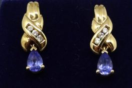 A pair of 14ct diamond and tanzanite drop earrings.