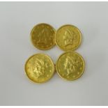 A pair of gold cufflinks set with four 1853 US dollar coins, approx. 7.7g.