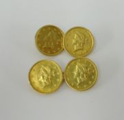 A pair of gold cufflinks set with four 1853 US dollar coins, approx. 7.7g.