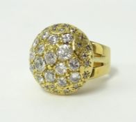 A large 18ct diamond 'bombe' shaped dress ring.