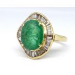A large emerald and diamond cluster ring, the emerald approx. 11mm x 9mm set within a border of