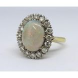 An 18ct opal and diamond cluster ring, Size P.
