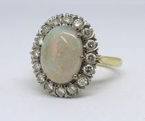 An 18ct opal and diamond cluster ring, Size P.