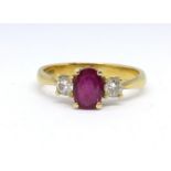 A 18ct ruby and diamond three stone ring, size M.