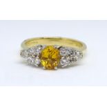 An 18ct yellow sapphire and diamond ring, size K.