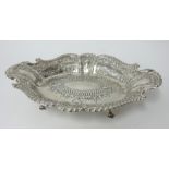 A Victorian silver oval dish with embossed sides, maker HA, Sheffield 1889, approx. 14.45oz.