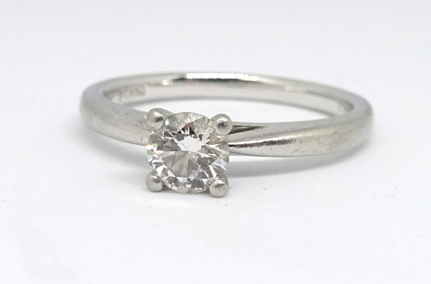 A Brilliant Fire platinum diamond solitaire ring, with IGI certificate indicating 0.40 carat