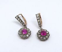 A pair of Victorian ruby and diamond cluster earrings.