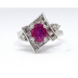 A good 18ct white gold, ruby and diamond set ring, size M.