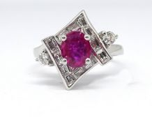 A good 18ct white gold, ruby and diamond set ring, size M.