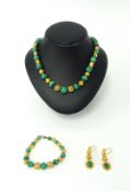 A matching suite of Malachite comprising- a single row graduated bead necklace consisting of