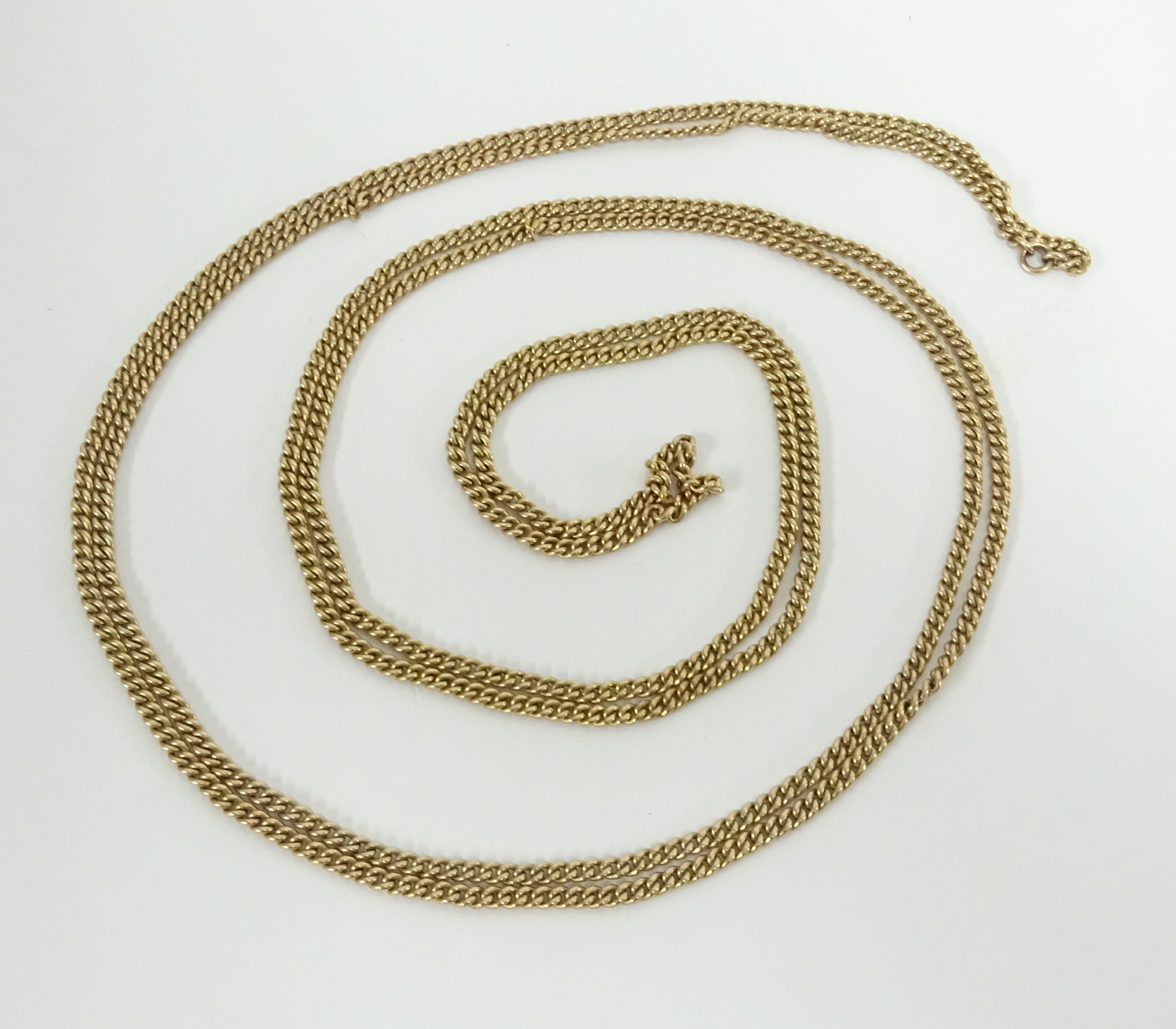 A yellow metal long chain, possibly 9ct gold, approx. 44.20g.