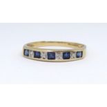 A 9ct sapphire and diamond channel set engaged eternity ring, size Q.