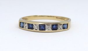 A 9ct sapphire and diamond channel set engaged eternity ring, size Q.