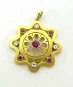 An Edwardian ruby and diamond pendant.