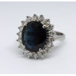 An 18ct sapphire and diamond cluster ring, size M.