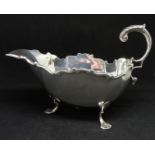 A Victorian silver sauce boat with scroll edge and pad feet, Chester 1899, approx. 5.13oz.