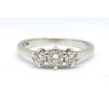 An 18ct white gold and three stone diamond ring, total weight approx. 0.50carat, size P.