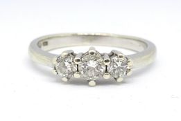 An 18ct white gold and three stone diamond ring, total weight approx. 0.50carat, size P.