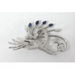 An 18ct white gold diamond and sapphire brooch marked '750, H.S', width 43mm, height 24mm.
