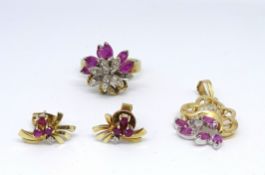 A 14ct ruby diamond suite comprising flower ring, size M, and pair of earrings and pendant,
