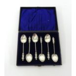 A set of George V silver apostle spoons cased.