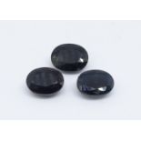 Three loose oval cut sapphires.