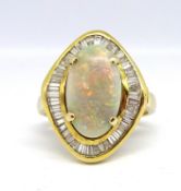 A large opal and diamond cluster ring, of similar design to lot 66 the opal approx. 15mm x 9mm,