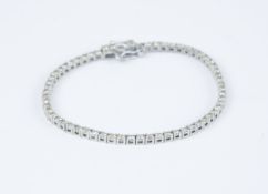 An 18ct white gold diamond tennis bracelet set with approx. 3 carats of diamonds.